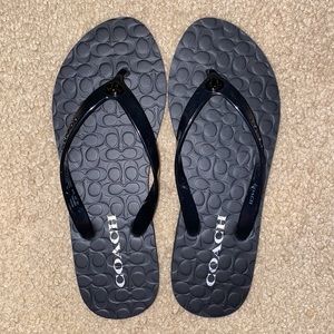 Coach Abbigail rubber flip flops size 7 in black. NWOT